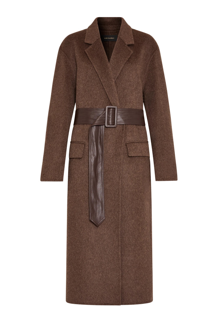 Long tailored coat with wide lapels, flap pockets, and vegan leather belt; structured wool fabric, front view on white.