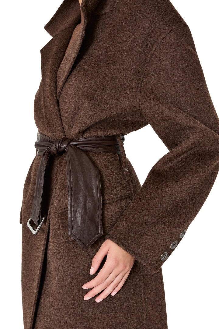 Longline silhouette silk wool coat with wide collar, vegan leather belted waist; front view on model.
