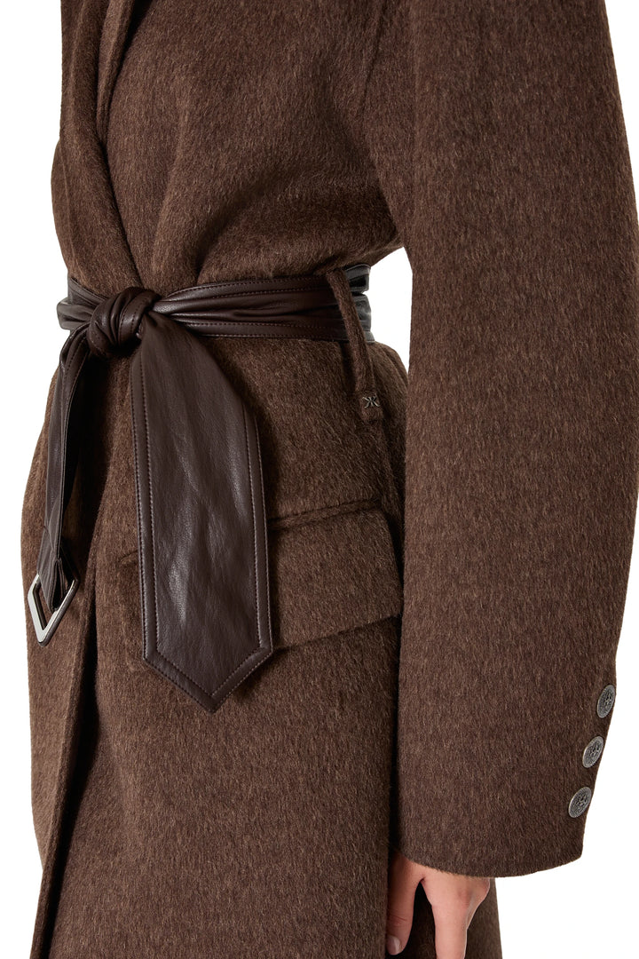 Vegan leather belt detail and buttoned sleeve of the Danielle Silk Wool Coat in mocha, detailed stitching shown, detail view.