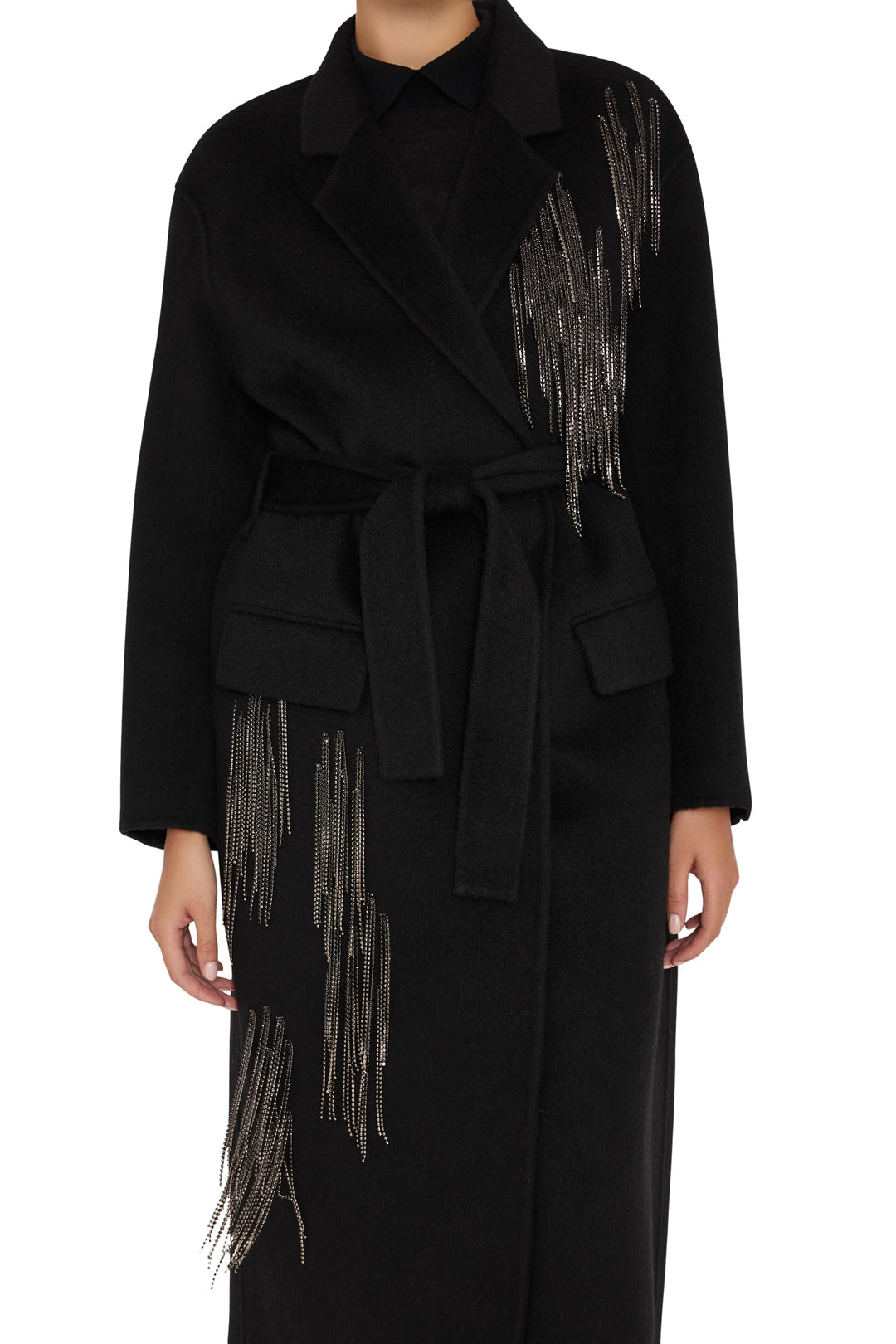 Long wool-blend coat, belted, silver bead fringe accents, tailored silhouette. Front view on white.