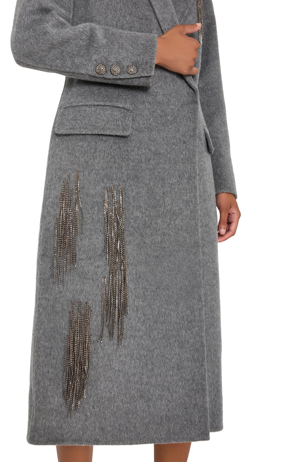 Long tailored wool-blend coat with metallic fringe trim, decorative sleeve buttons; front view on white.