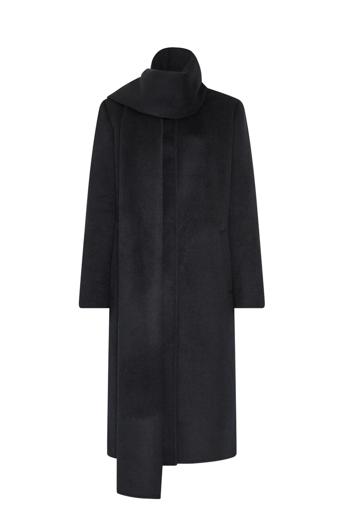 Structured wool coat with sculptural shoulders, detachable scarf, and high collar; front view on white.