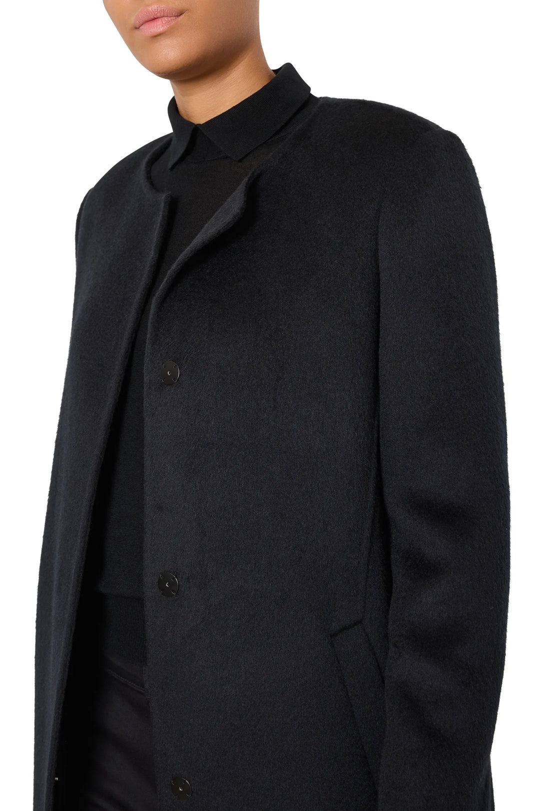 Sculptural-shoulder wool coat with detachable scarf, tailored silhouette, collared neckline; front view on model.