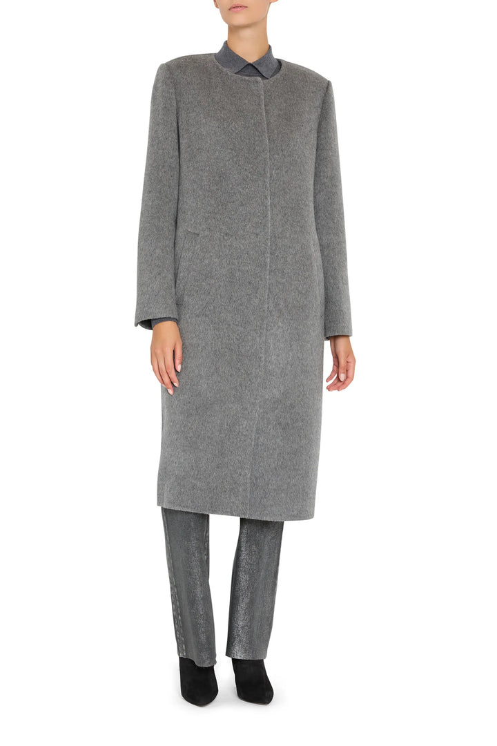 Wool coat with detachable scarf, tailored silhouette, structured shoulders, clean lines; front view on white.