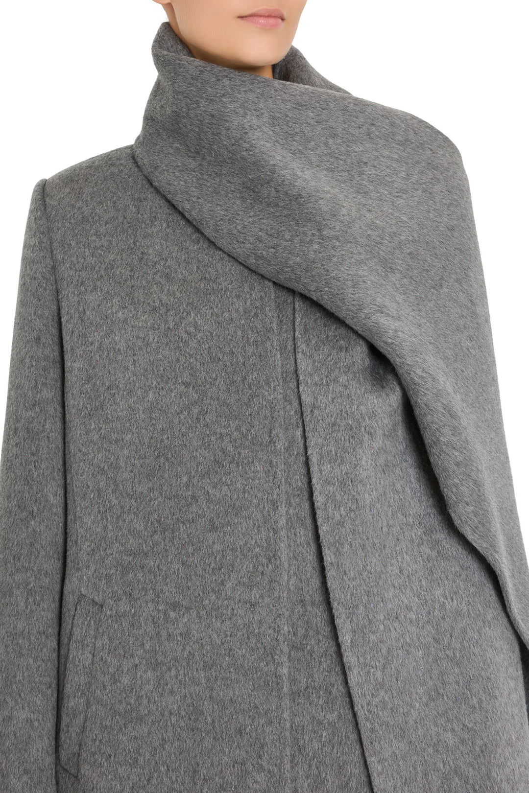 Draped, wool coat with a dramatic collar and detachable scarf; structured silhouette; front view on model.
