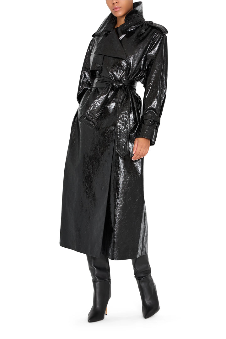 Longline vegan leather coat with self-tie belt, structured shoulders, clean lines; front view on model.