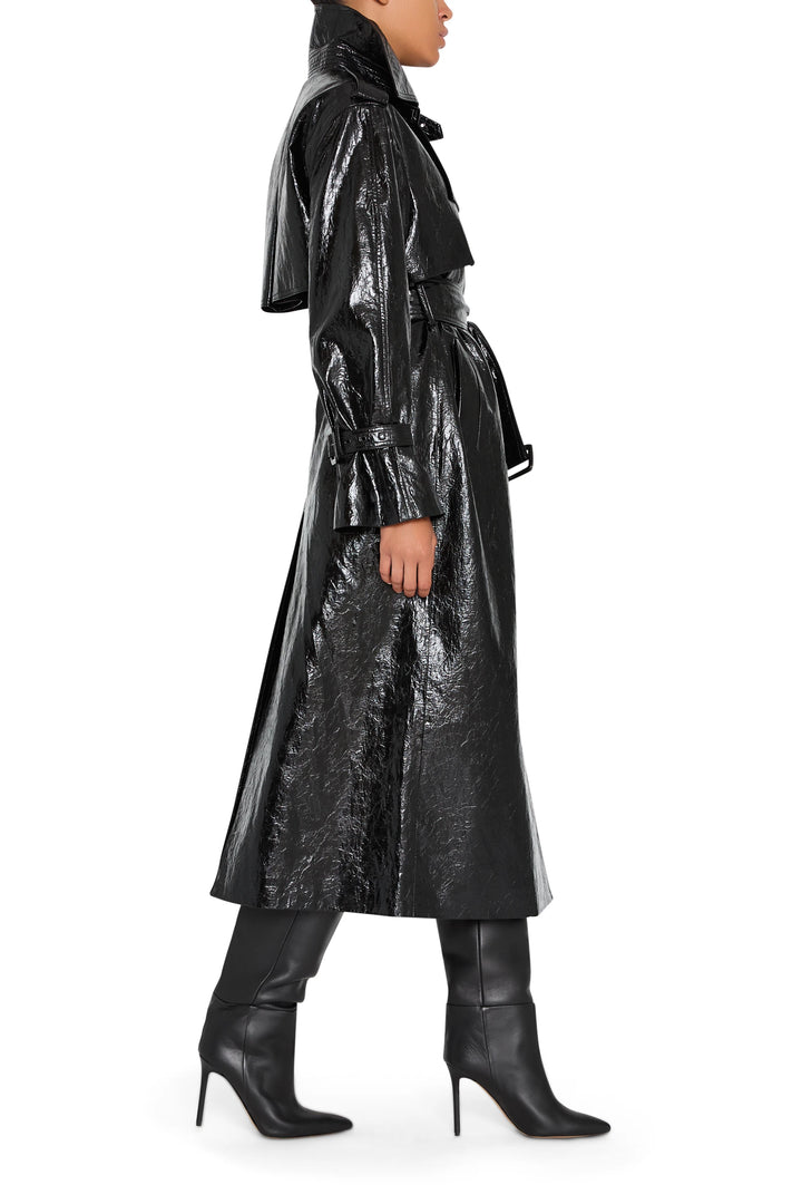 Rose vegan leather coat with clean tailoring and structured silhouette, button front, side view on model.