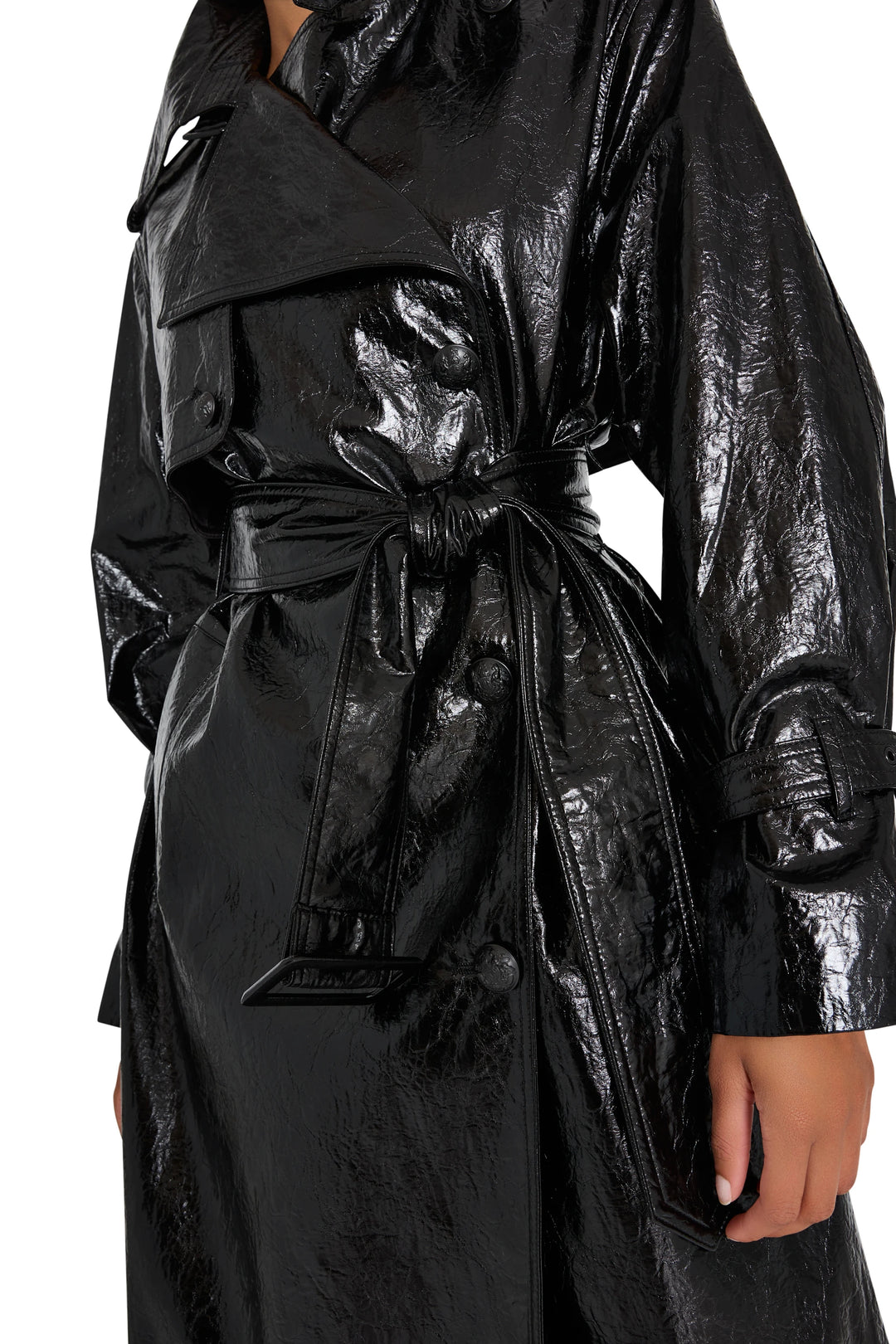 Shiny vegan leather coat with bold lapels and military details, structured silhouette; front view on model.