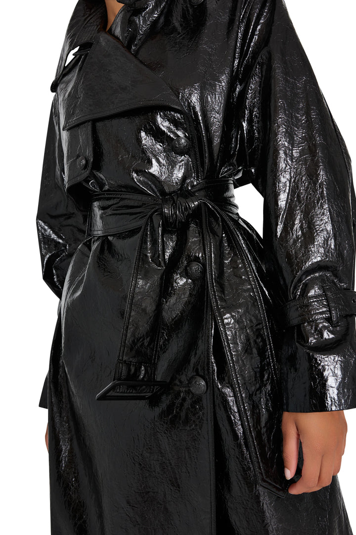 Shiny vegan leather coat with bold lapels and military details, structured silhouette; front view on model.