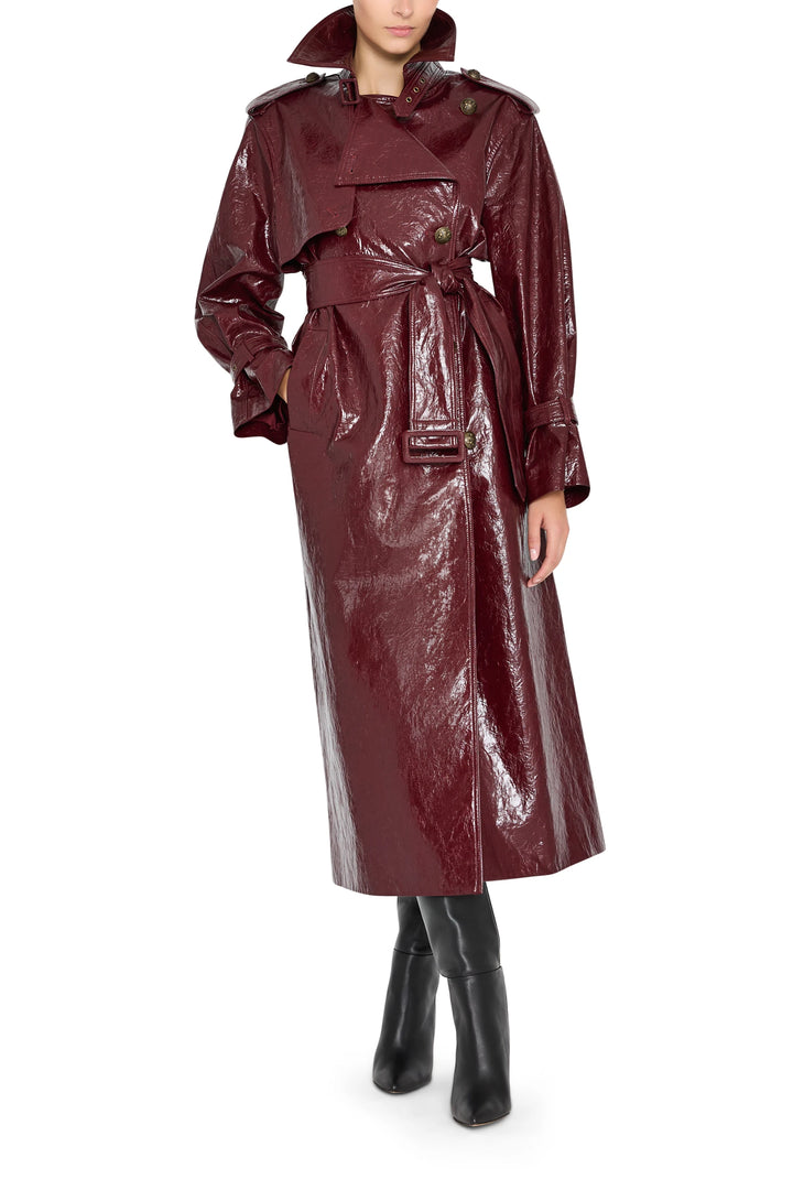 Rose vegan leather coat with tailored silhouette, notched lapel, and button closure; front view on model.
