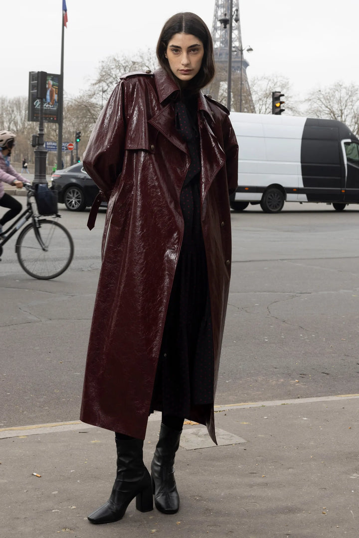 Rose vegan leather coat with structured silhouette and tailored seams, front view on model.