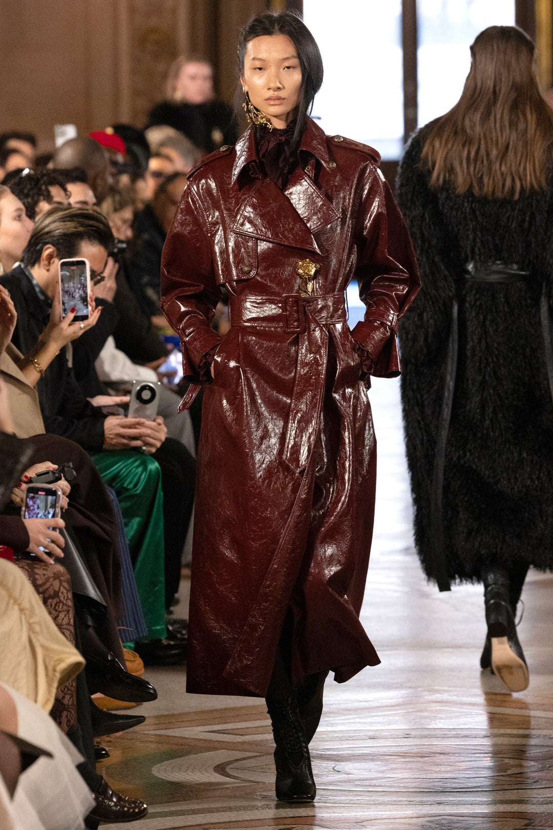 Rose Vegan Leather Coat with matching belt, tailored silhouette, front pockets; front view on model.