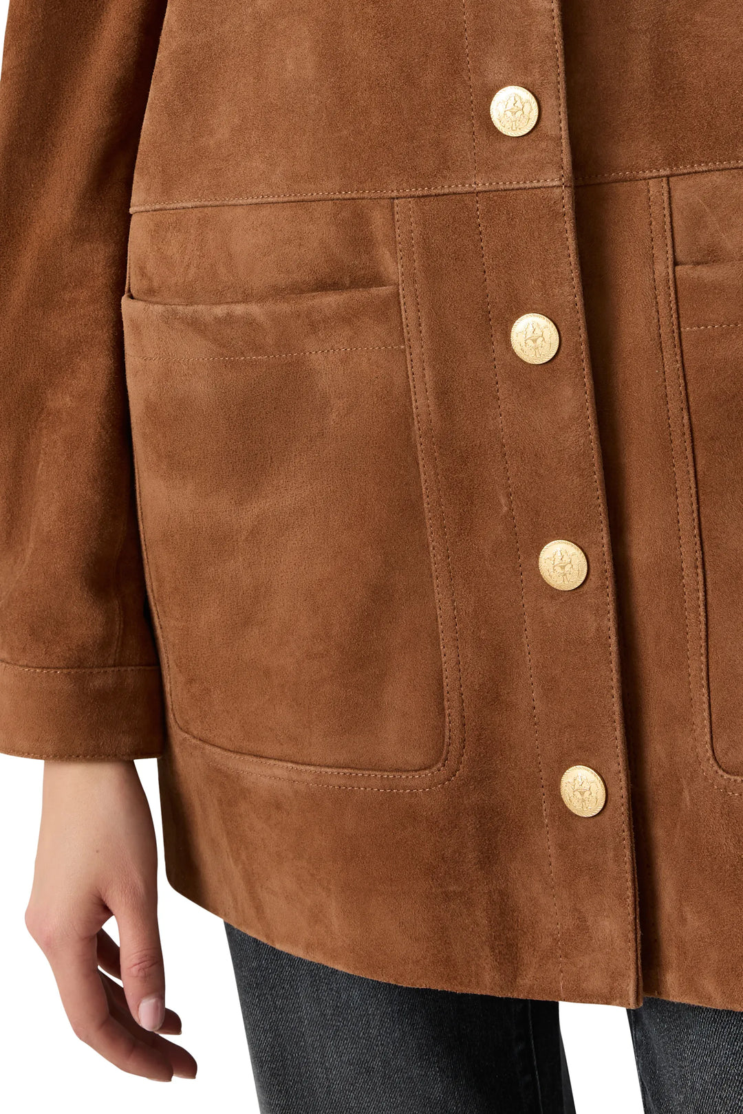 Artisan snaps and large front pockets on suede fabric, detailed construction shown. Detail view.