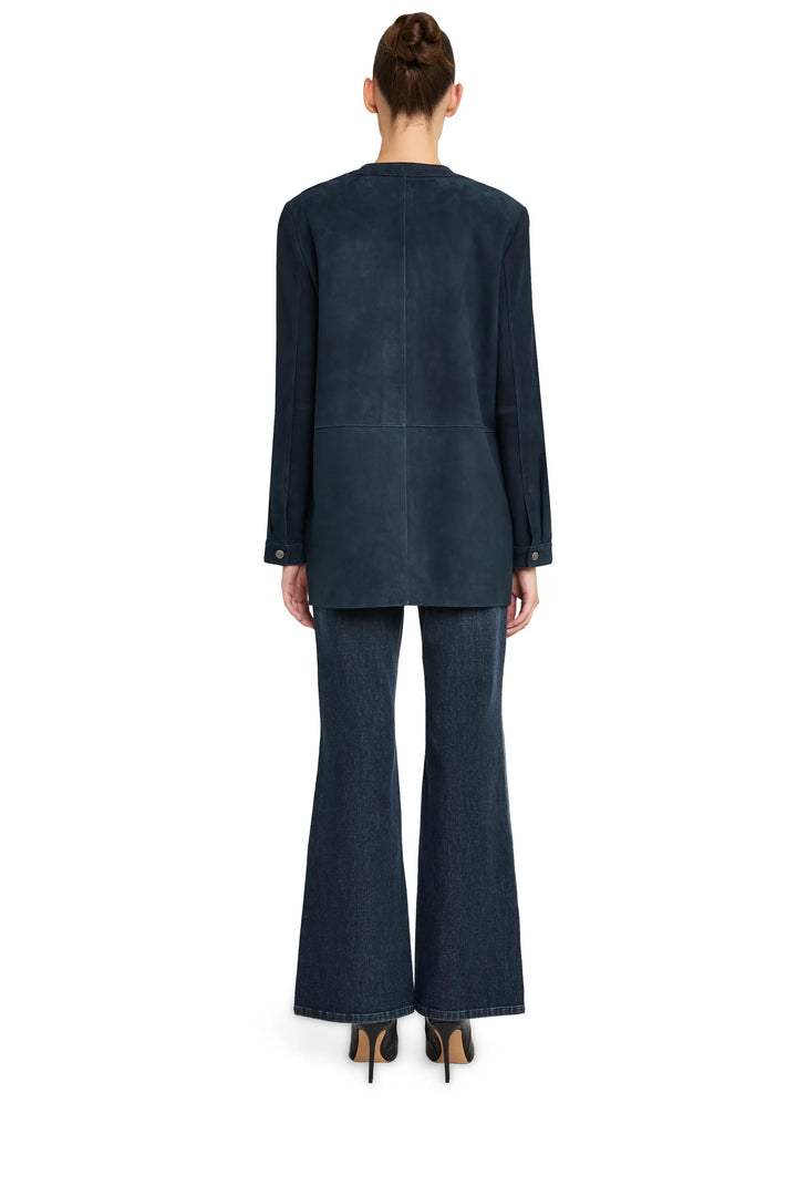 Suede coat with clean lines, straight silhouette, structured seams; back view on model.
