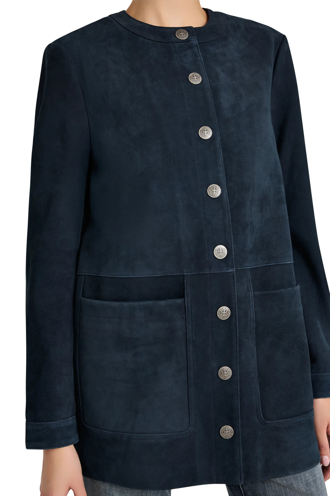 Straight-cut suede coat with large front pockets and artisan snaps, hip-length silhouette. Front view on model.