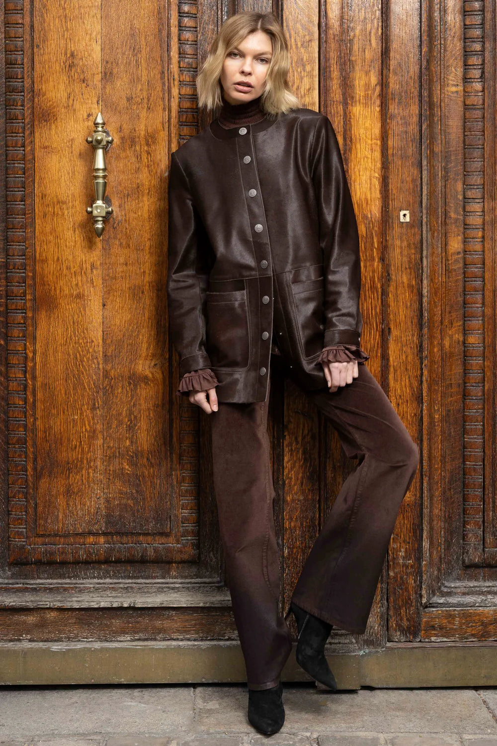 Wide-leg stretch velvet pant with clean waistband and slight sheen, full length; front view on model.