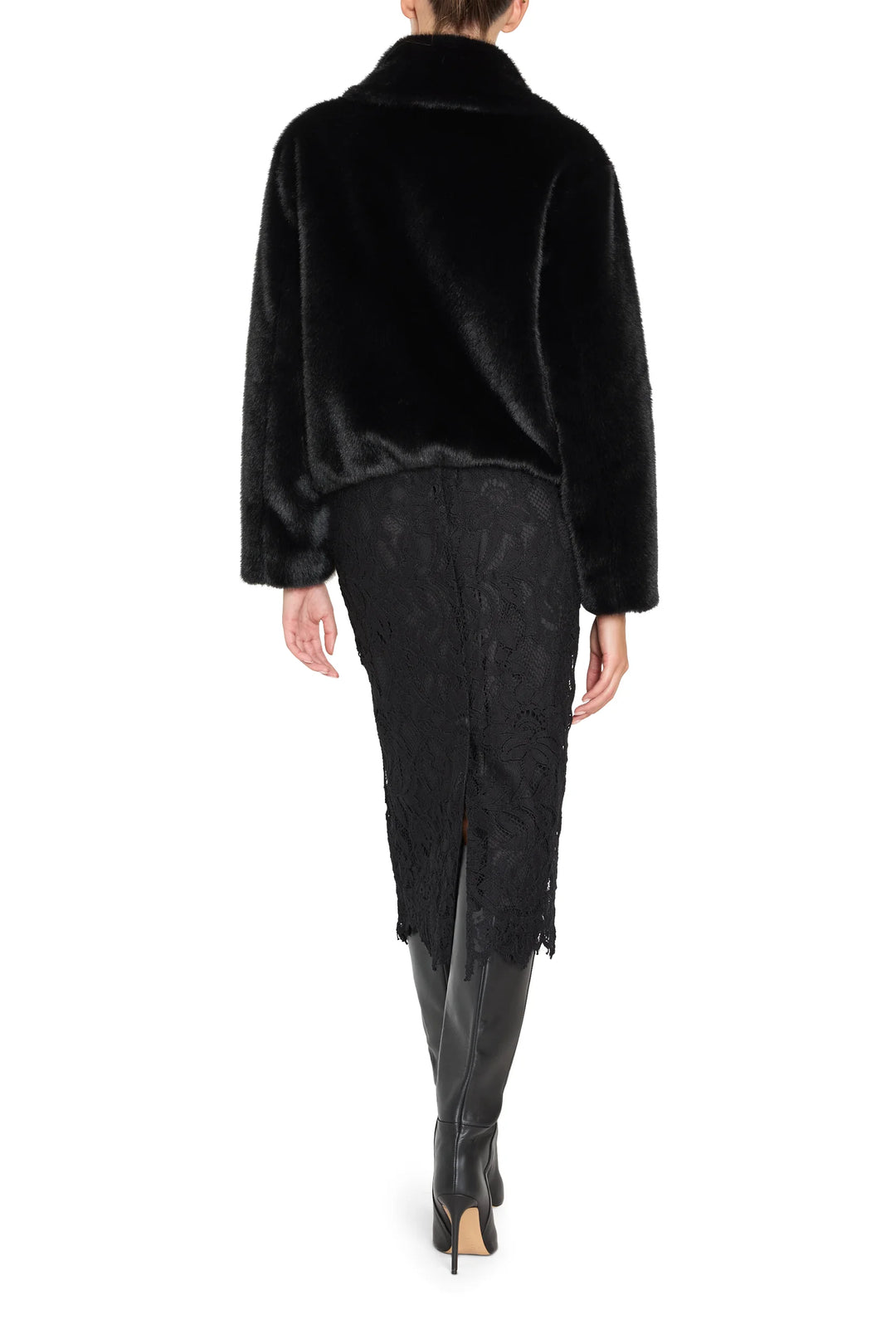 Short faux fur coat with jeweled accents, structured silhouette, plush texture; back view on model.