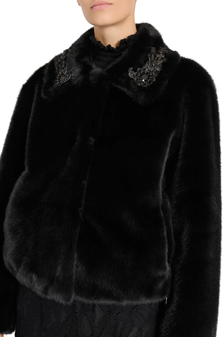 Cropped faux fur jacket with beaded collar detail, retro silhouette and structured fit; front view on model.