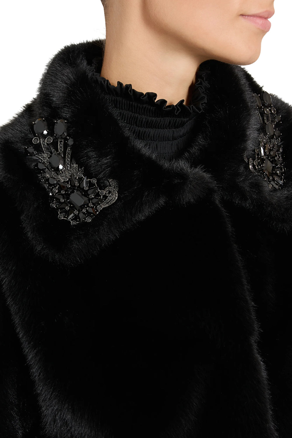Faux fur short coat with jeweled collar, classic straight silhouette, structured fit; front view on model.