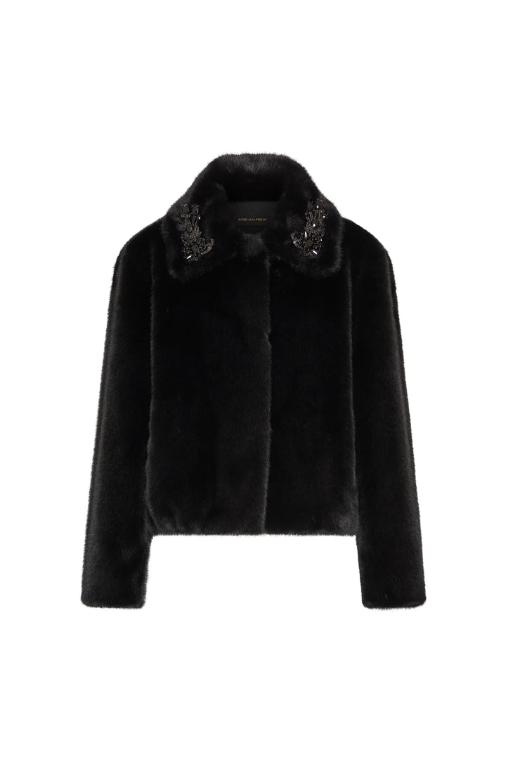 Cropped faux fur jacket with retro silhouette, jeweled brooches on collar, structured fit; front view on white.