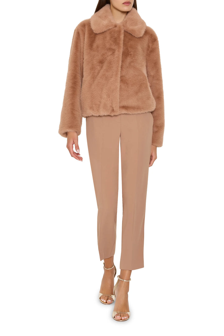 Short coat in faux fur with jeweled embellishments, structured silhouette; front view on white.