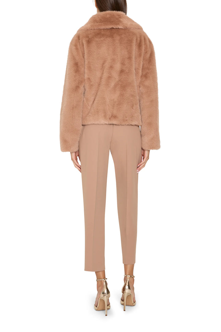 Short faux fur coat with jeweled embellishments, straight silhouette; back view on model.