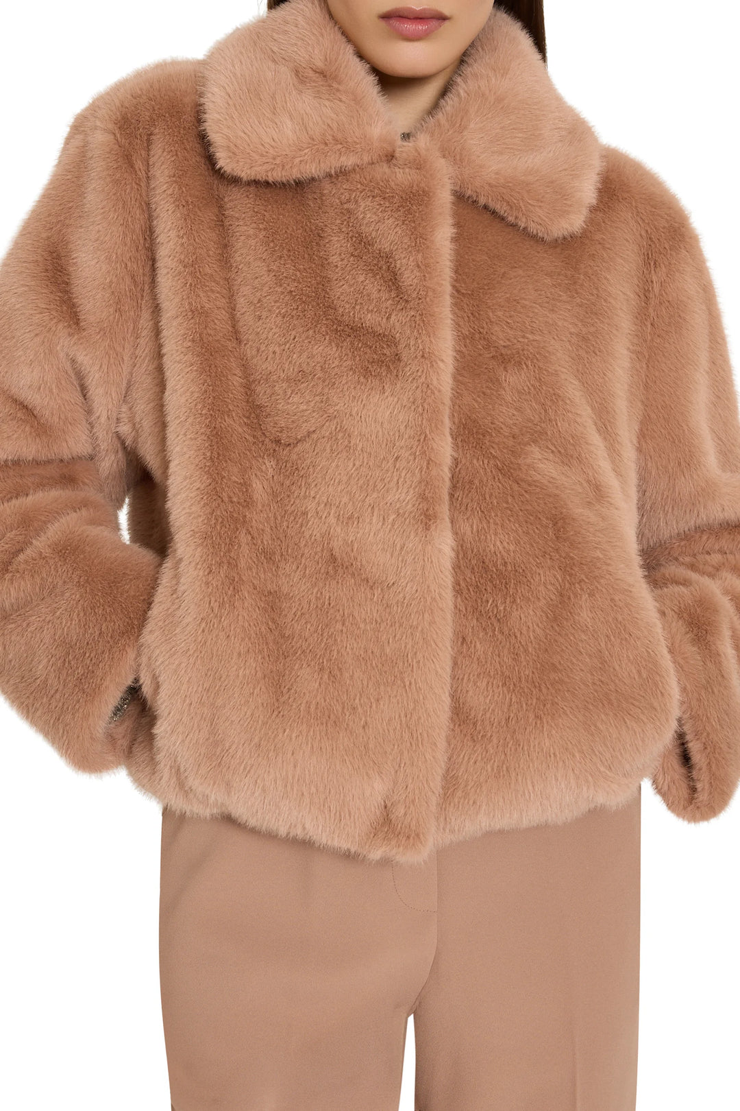 Short faux fur coat with relaxed silhouette, jeweled embellishments, collar, front closure; front view on model.