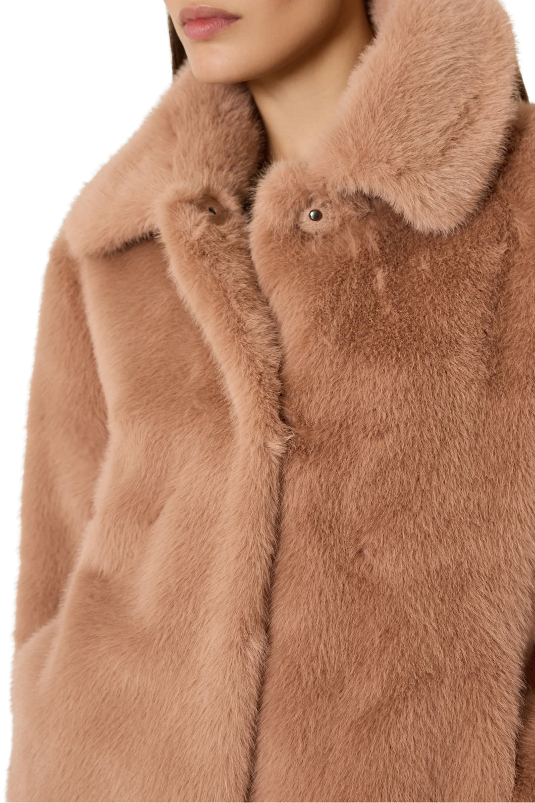 Short faux fur coat with oversized collar, jeweled button accents, boxy silhouette. Front view on model.