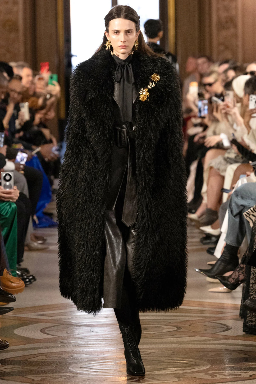 Long faux Mongolian belted coat with voluminous silhouette and textured fabric, front view on model.