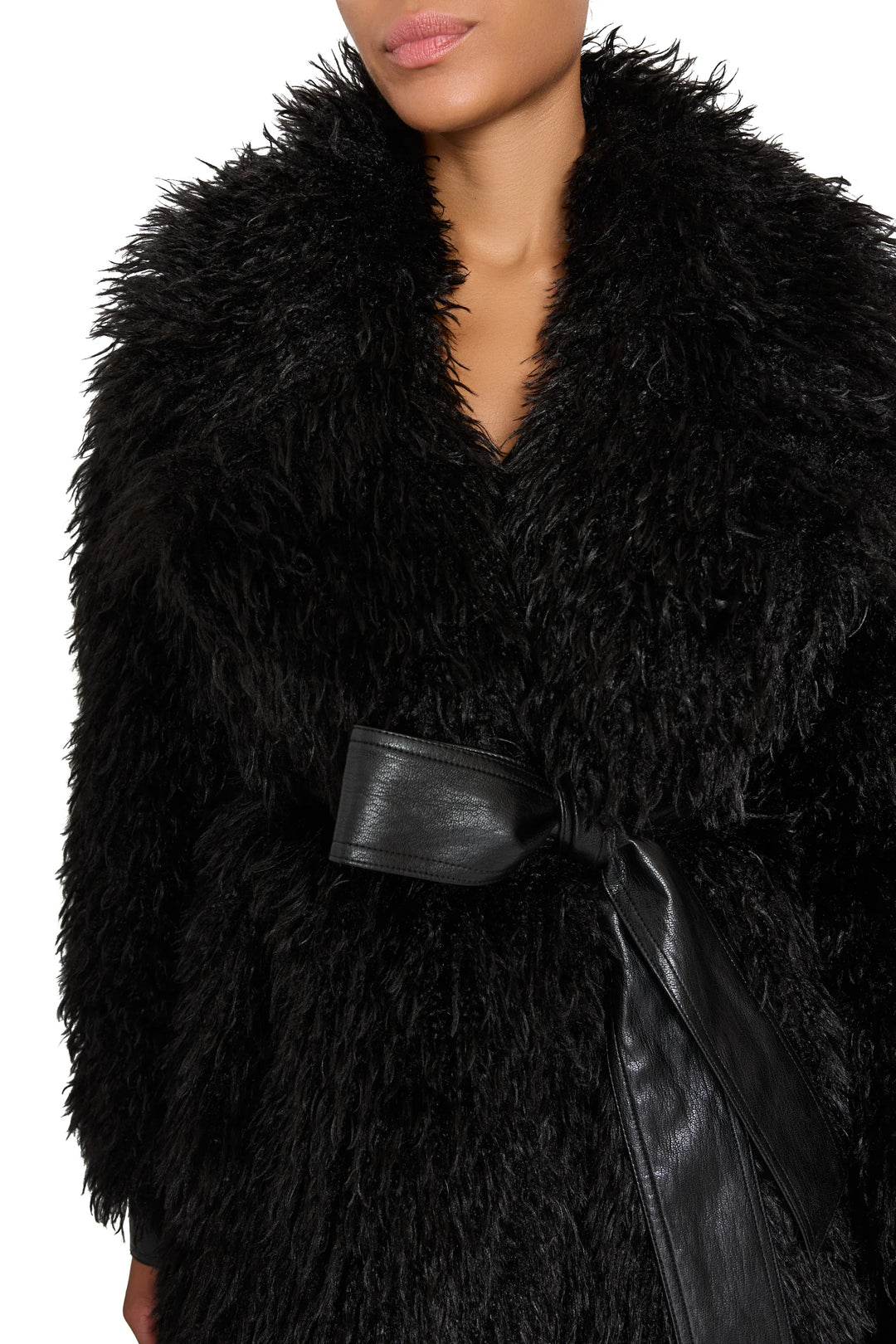 Faux Mongolian coat with plush textured fabric, wide vegan leather belt, relaxed silhouette; front view on model.