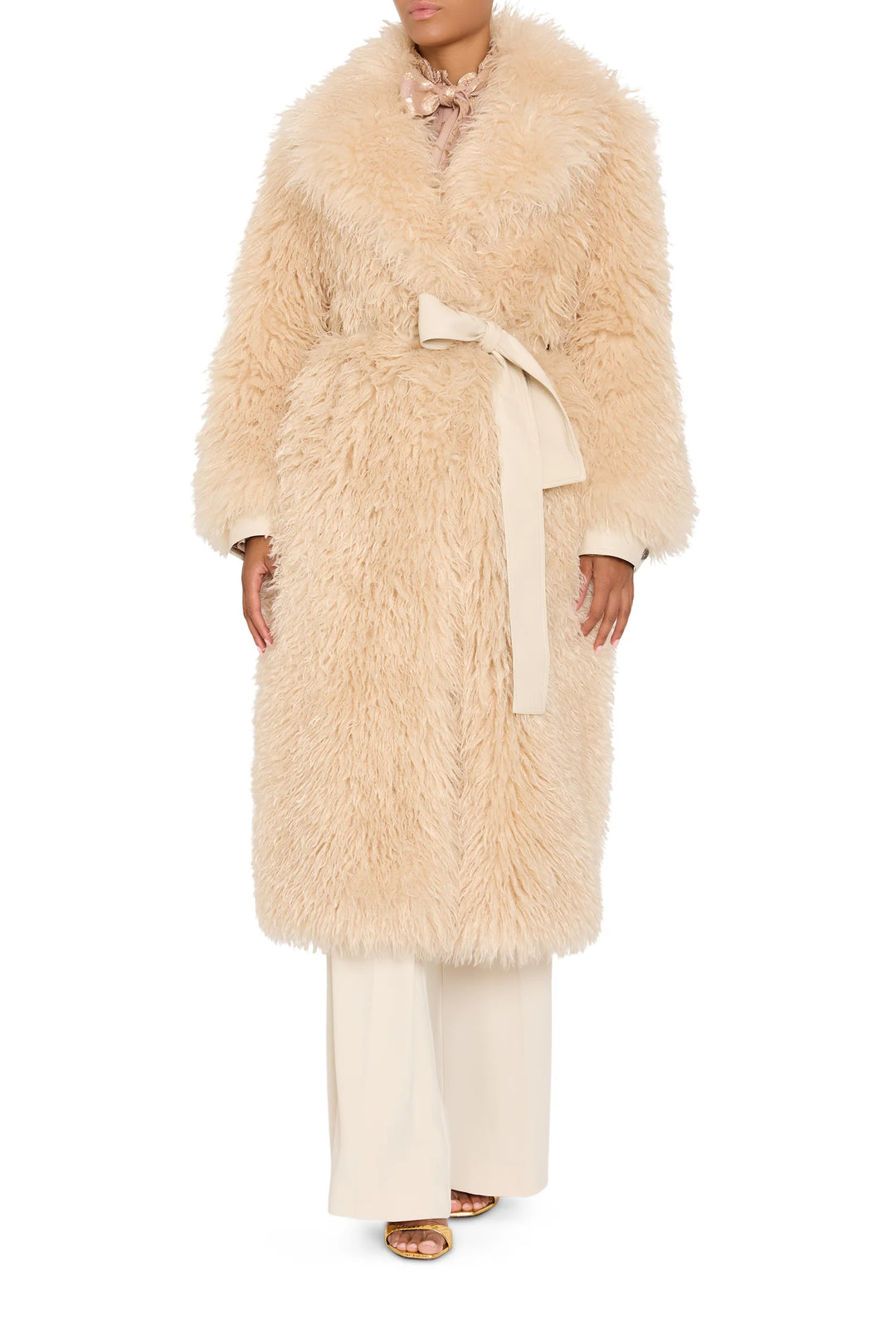 Faux Mongolian coat with belted waist, textured faux fur, relaxed fit silhouette. Front view on model.
