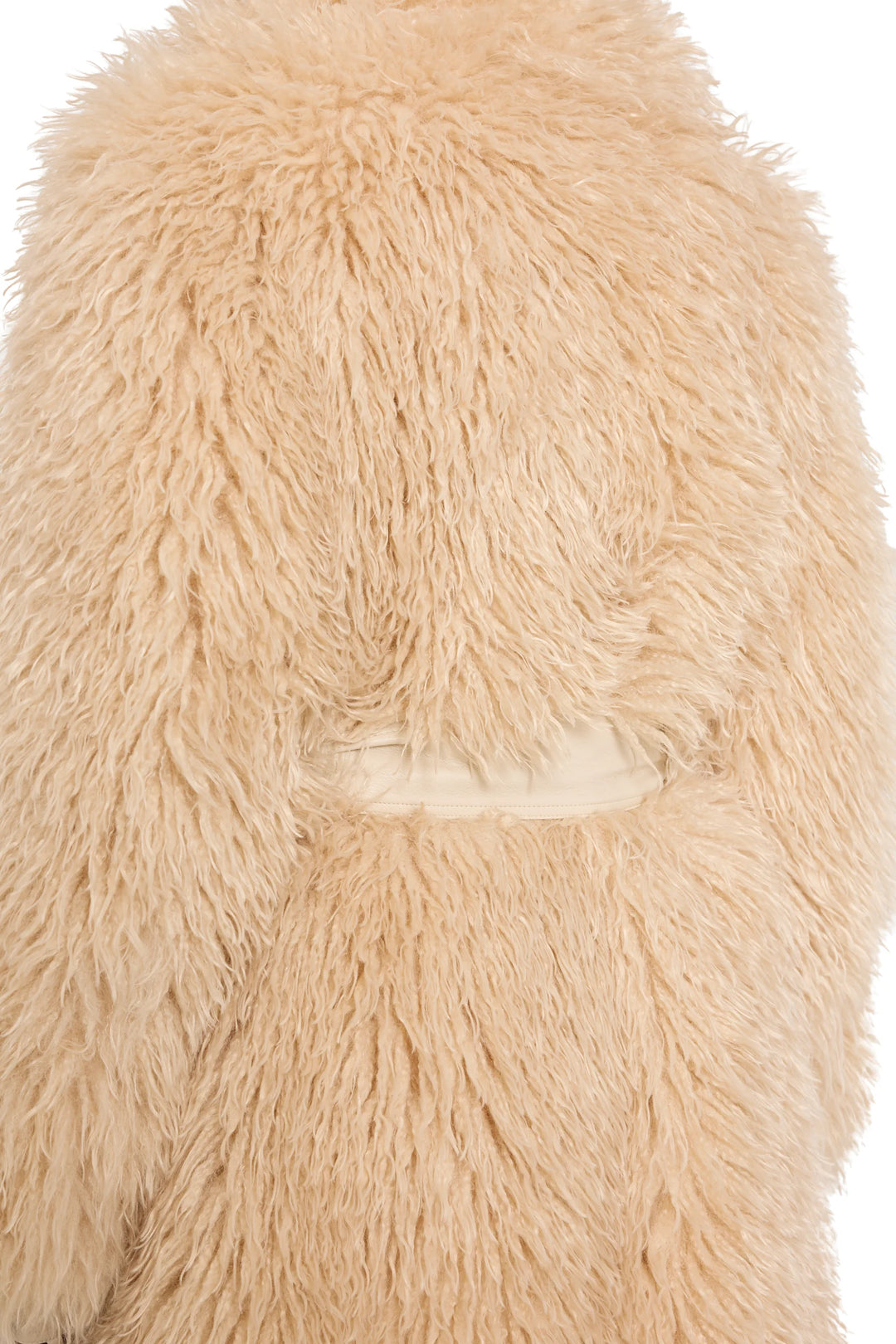 Detail of faux Mongolian fur texture and vegan leather belt construction. Detail view.