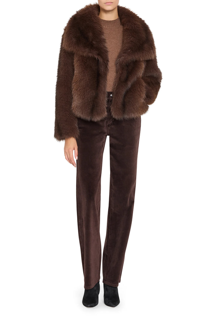 Faux fur short coat with relaxed silhouette and notch collar, front view on model.