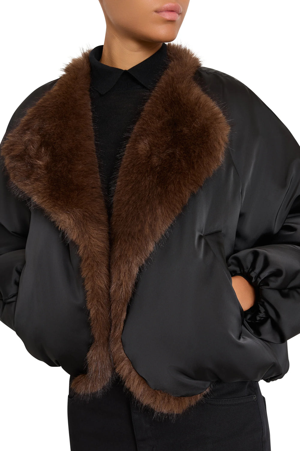 Black Nikki Nylon Coat with faux fur wide collar, structured silhouette, front pockets; front view on model.