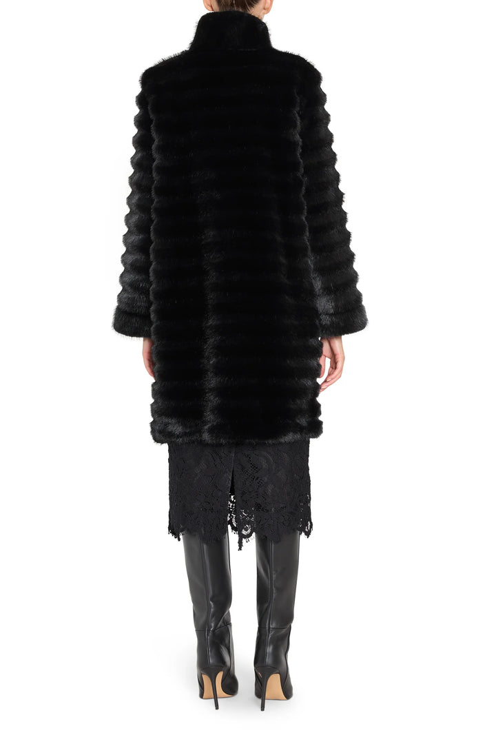 Long faux fur coat with jeweled embellishments, straight silhouette, full length; back view on model.