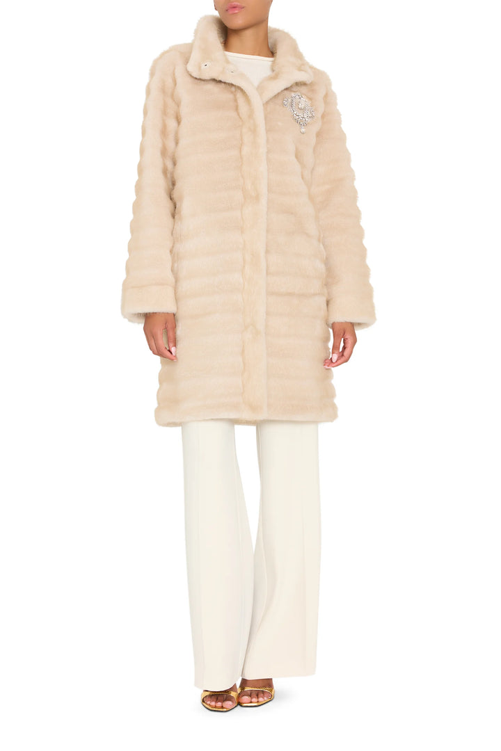 Long faux fur coat with jeweled embellishments, straight silhouette, full length, front view on white.