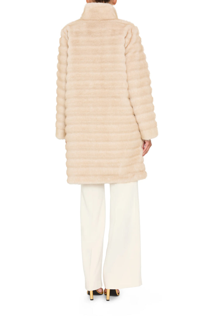 Long faux fur coat, straight silhouette, collarless, jeweled detail at collar; back view on model.