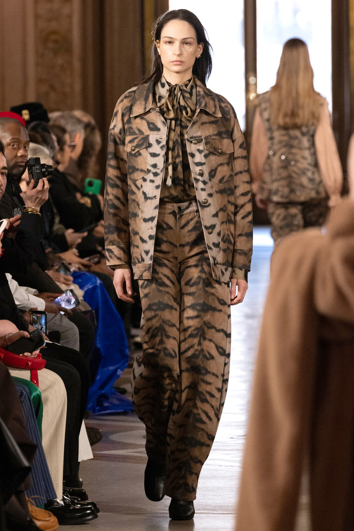 Relaxed-fit animal printed jacket with structured shoulders, button front, and chest pockets; front view on model.