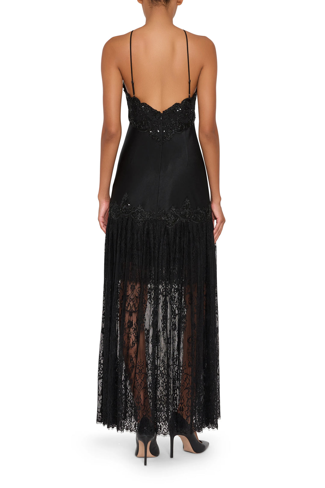 Sleeveless lace combo long dress with thin straps and sheer skirt, fitted bodice; back view on model.