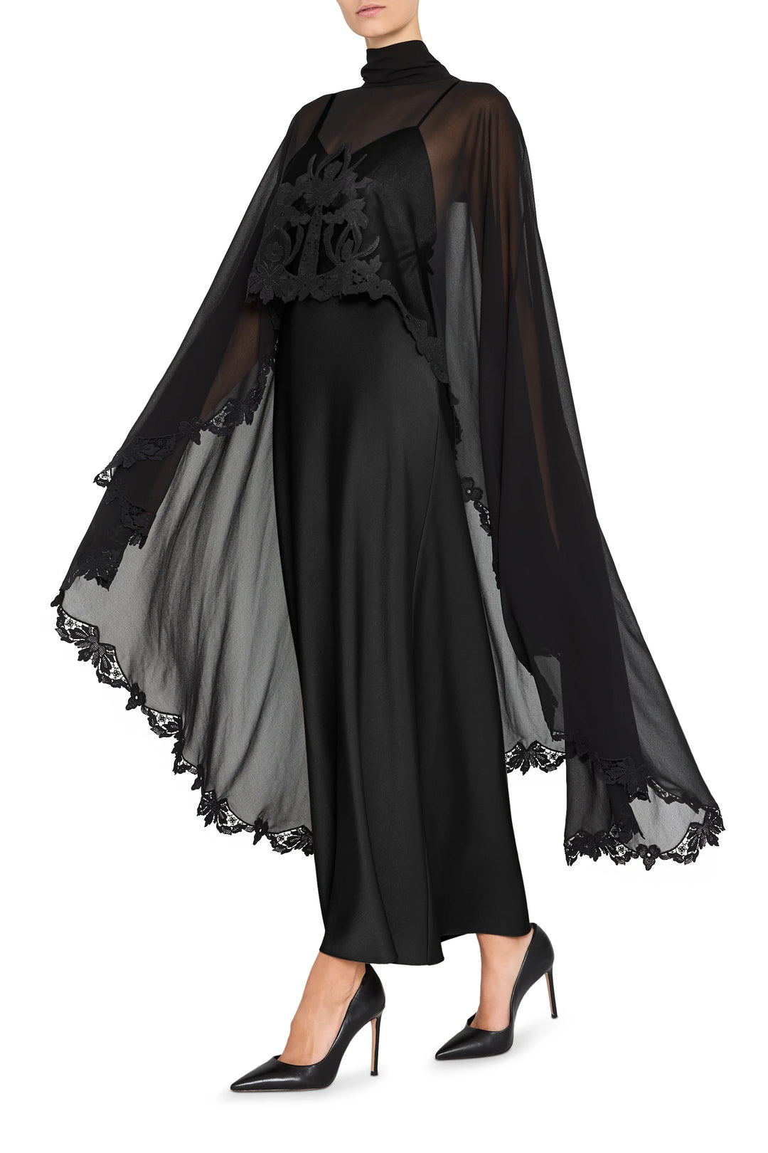 Sheer cape with lace trim over satin-back crepe long dress; fitted bodice, fluid skirt, front view on white.