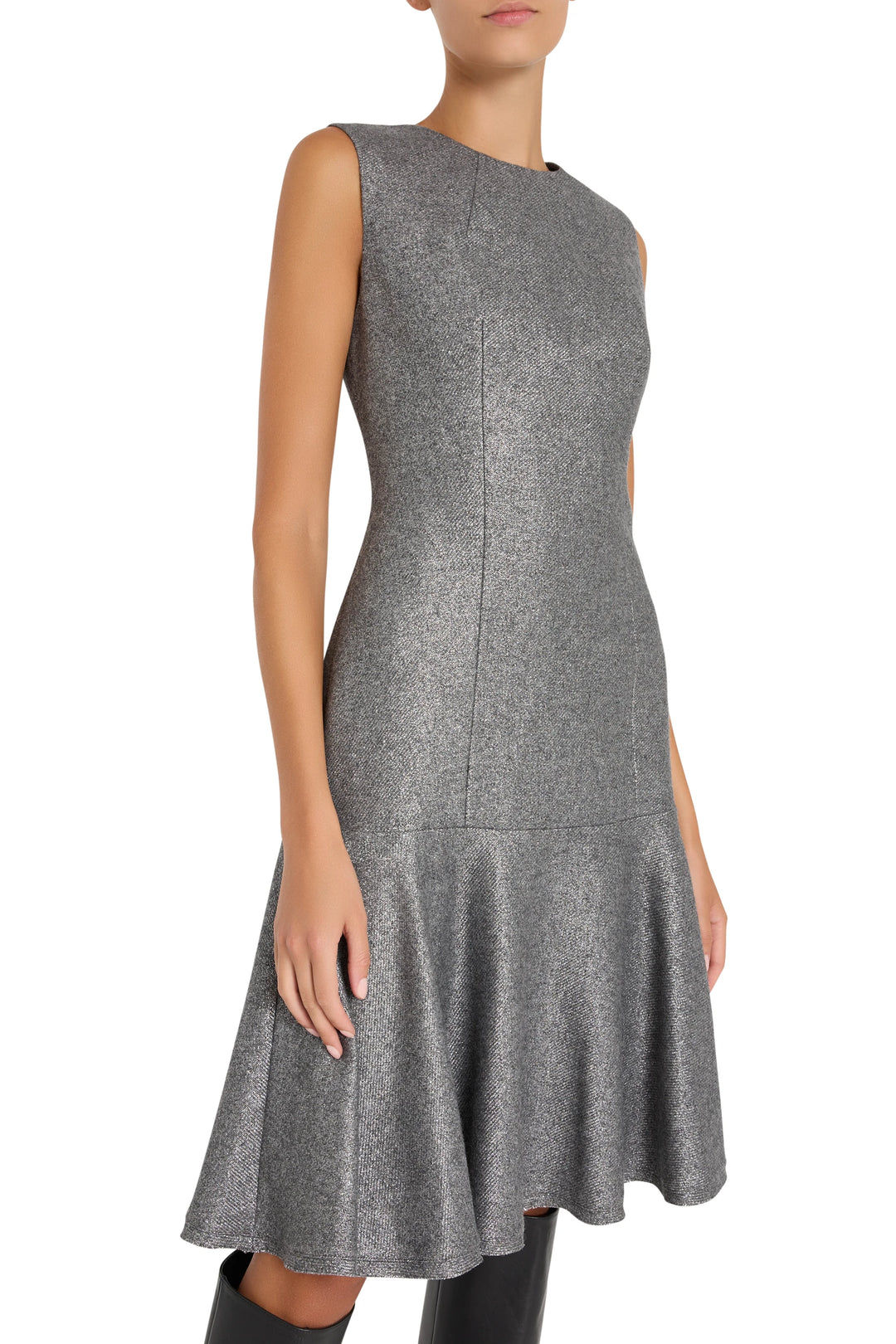 Fit-and-flare silhouette metallic wool dress with sleeveless bodice and ruffled hem, front view on model.