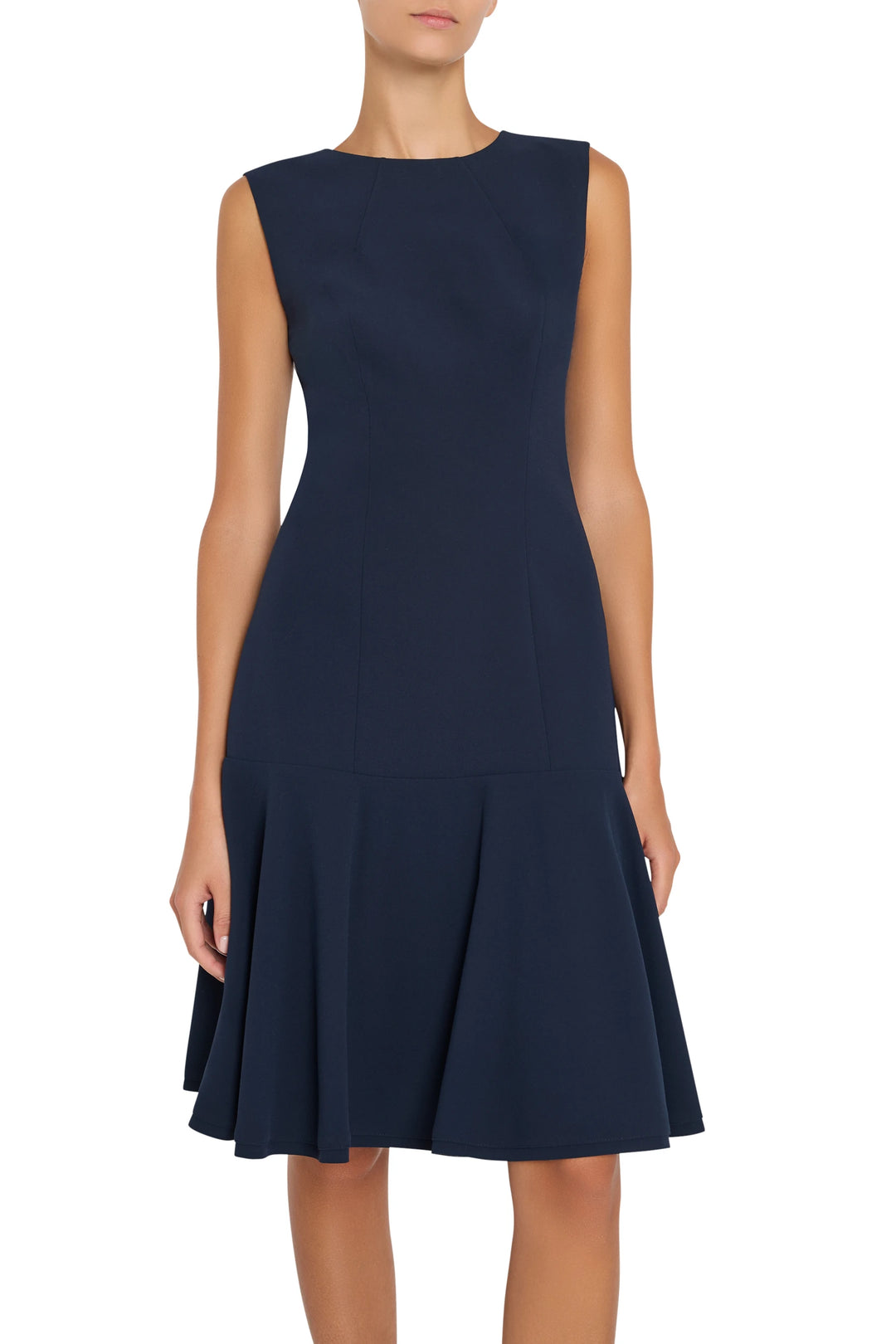 Sleeveless crepe fit-and-flare dress with drop waist, flared skirt, tailored seams; front view on white.
