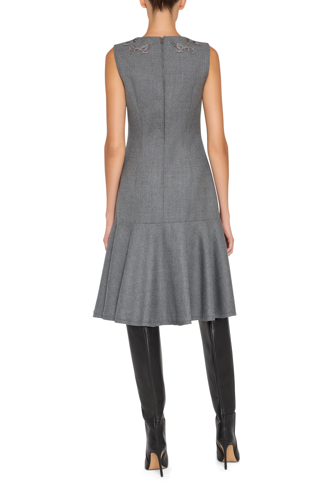 Embroidered flannel dress with flared hem, fitted waist, and tailored seams; back view on model.
