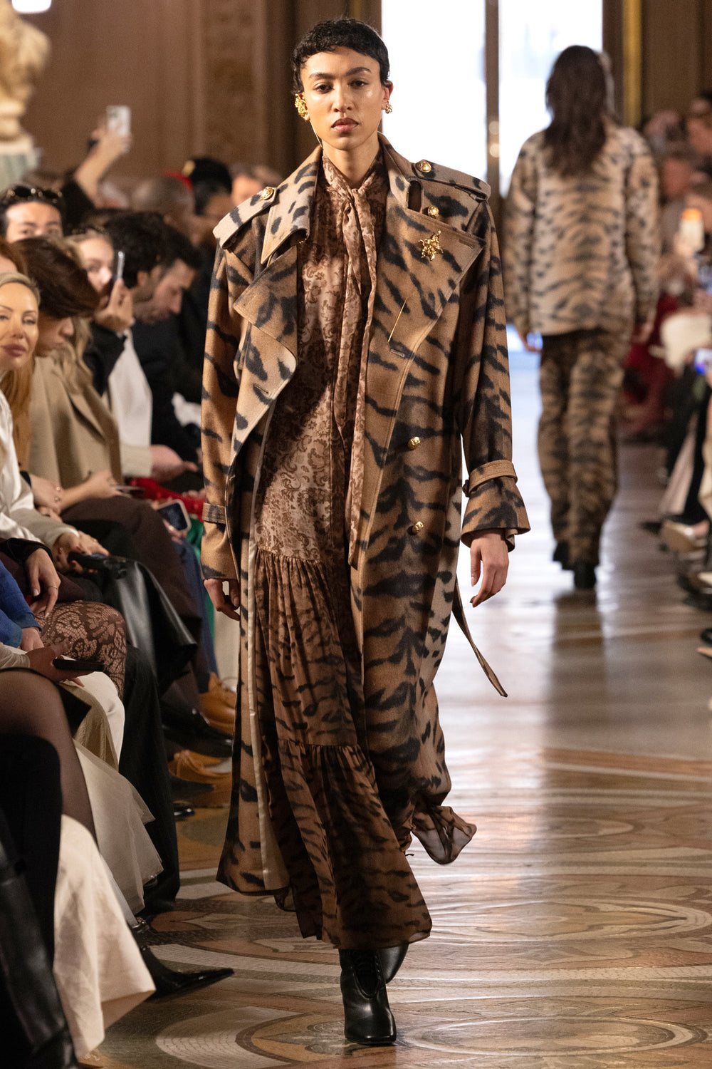 Midi dress with tiger stripe print, lace details, fitted bodice and flared skirt; front view on model.