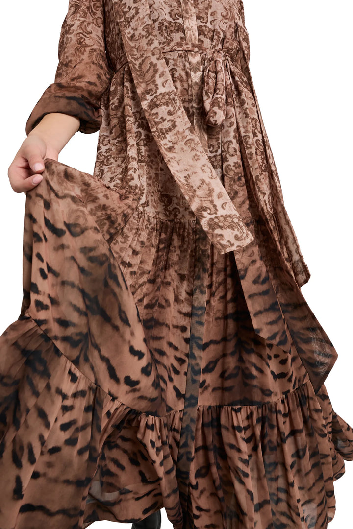 Maxi dress with fluid silhouette, tiger stripe print, constructed in lightweight fabric; front view on model.