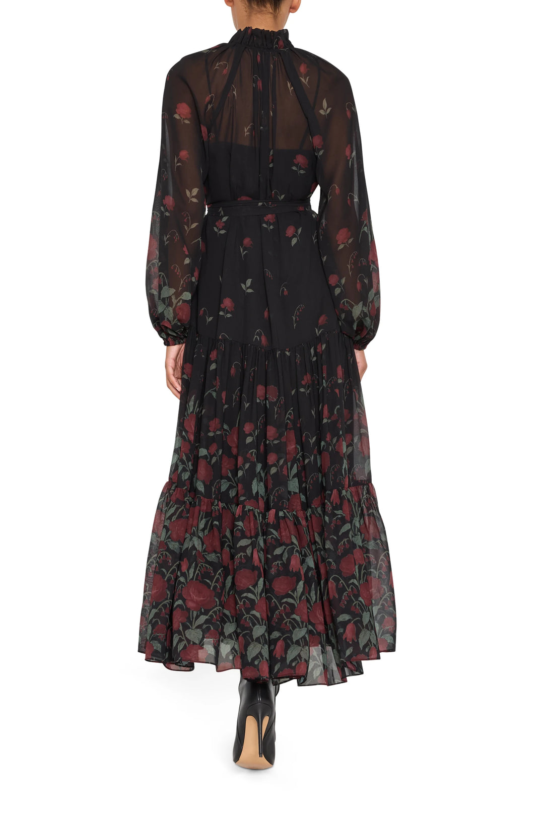 Chiffon long dress with front opening, long sleeves, fluid silhouette; editorial setting.