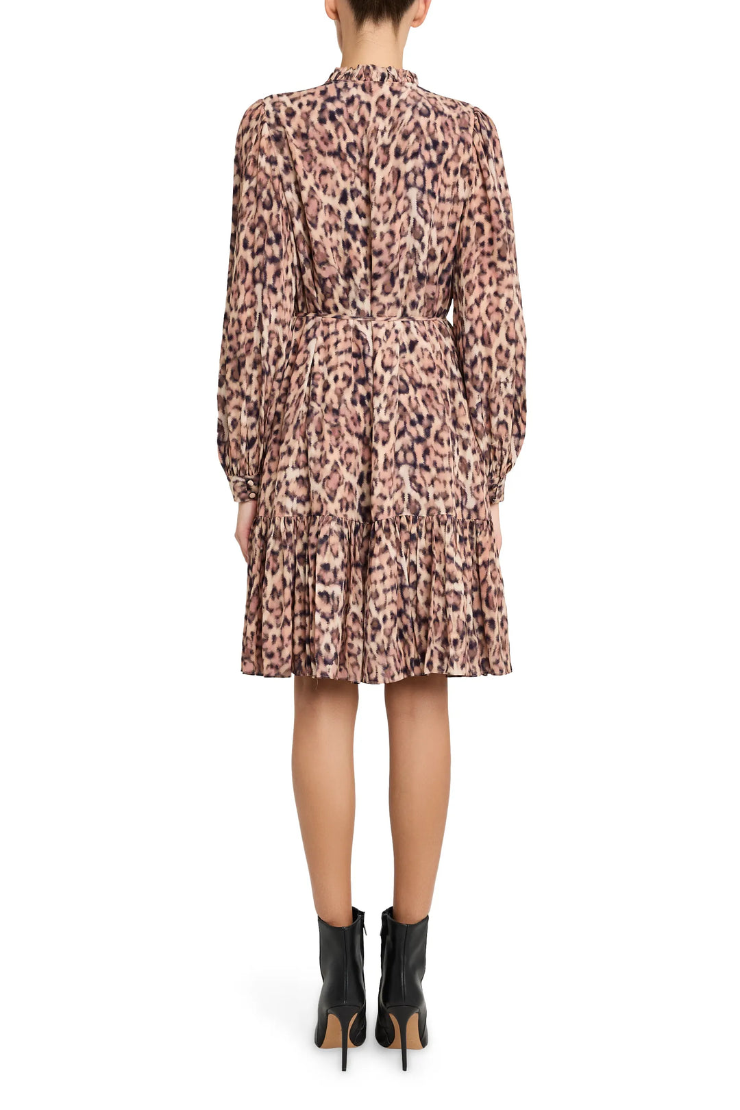 Fitted midi dress with long sleeves, allover leopard print, back zip closure. Back view on model.