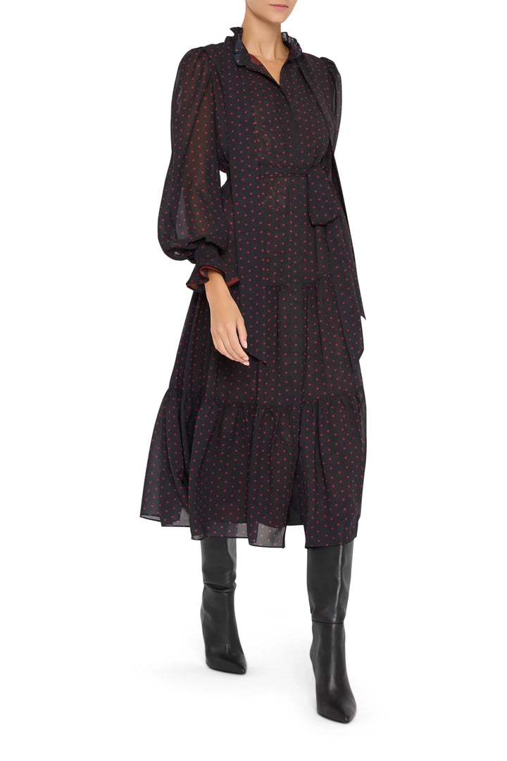 Polka dot chiffon dress with gathered waist and flowy midi skirt, button front, long sleeves; front view on model.