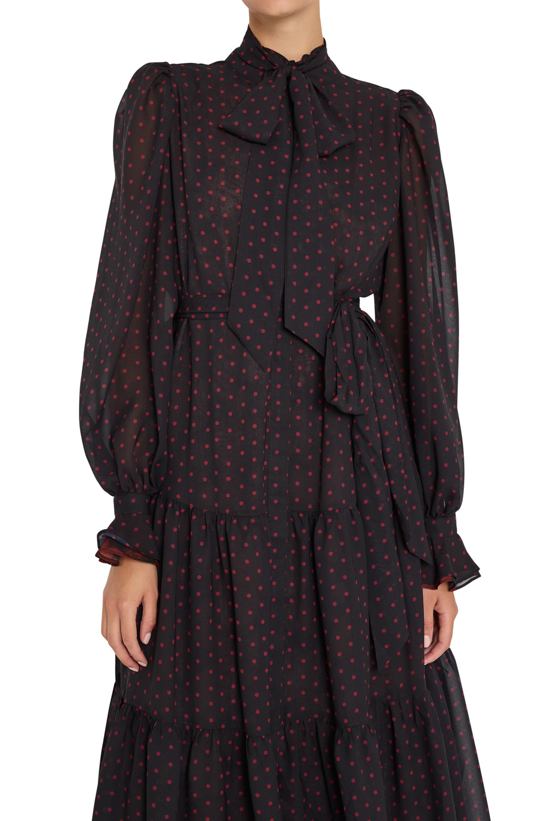 Sheer chiffon midi dress with gathered neck bow, puff sleeves, and softly draped skirt; front view on white.