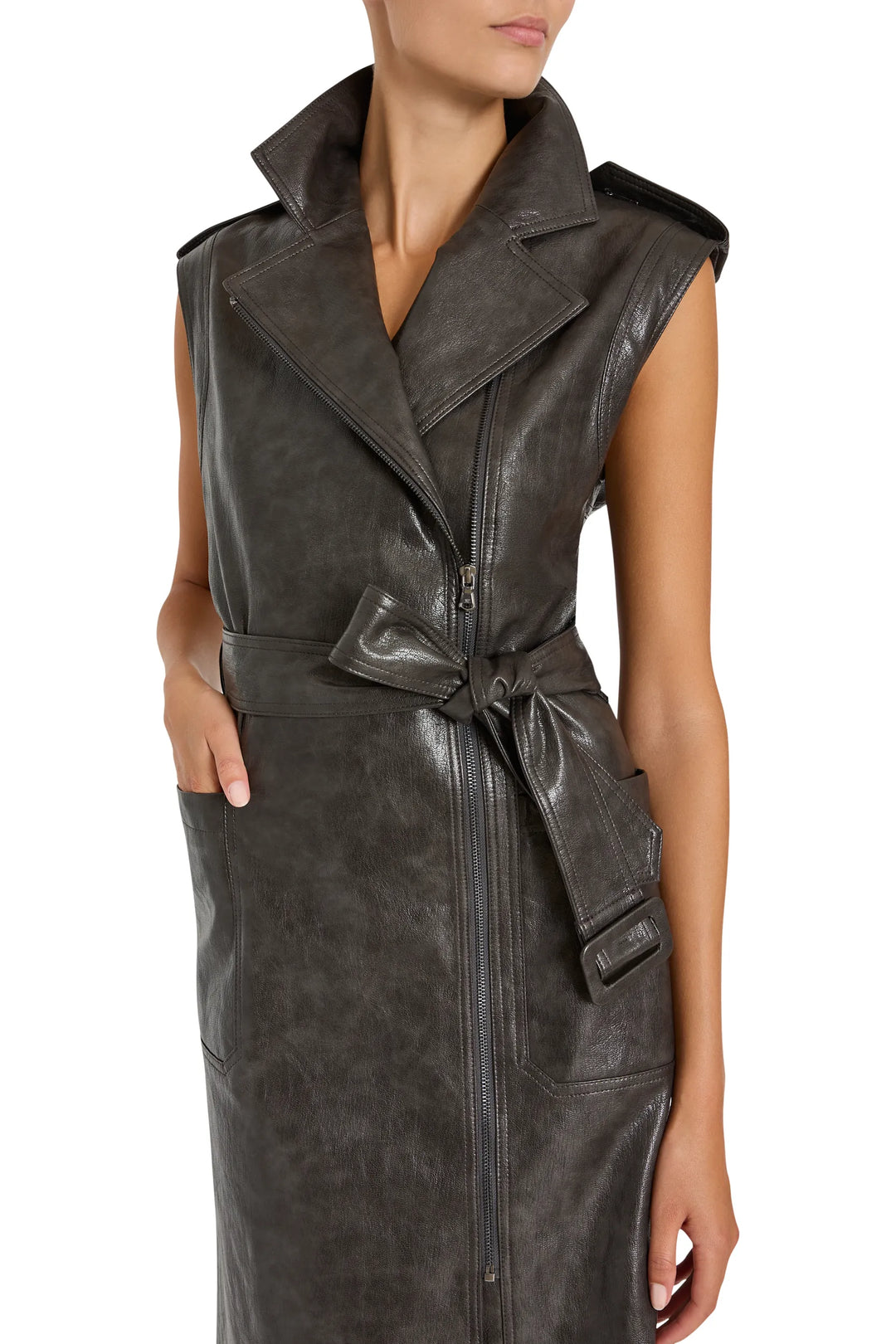 Moto-style vegan leather trench dress with wide collar, zip closure, statement belt; front view on white.